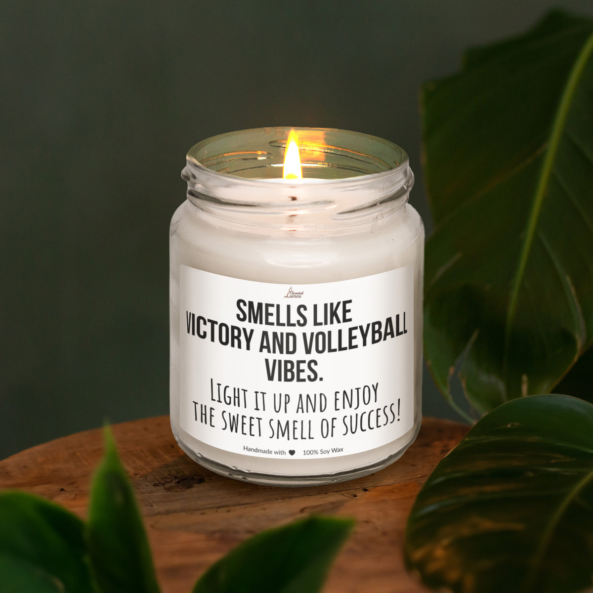 a white candle sitting on top of a wooden table