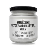a jar of white candles with a black lid