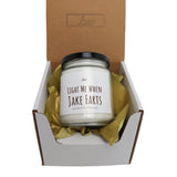 a candle in a box that says, light me when take fars