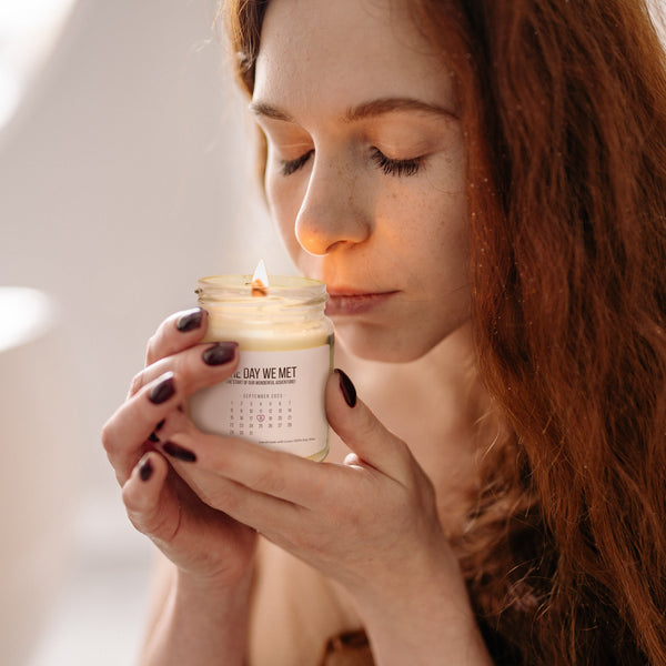a woman holding a jar of cream in her hands
