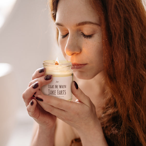 a woman holding a jar of light me up face masks