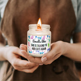 a woman holding a candle in her hands