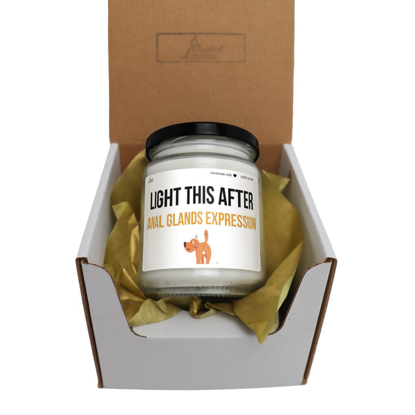 a candle in a box that says light this after