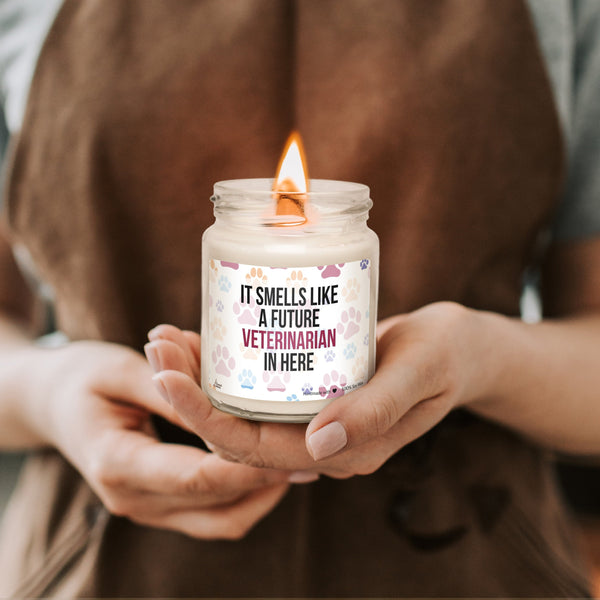 a woman holding a jar with a candle in it
