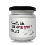 a white jar with a black lid that says smells life i got / band name