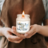 a person holding a candle with a message on it
