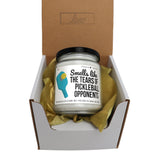 a small jar of pickleball opponent sits in a box