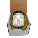 a dog candle in a box with a ribbon around it