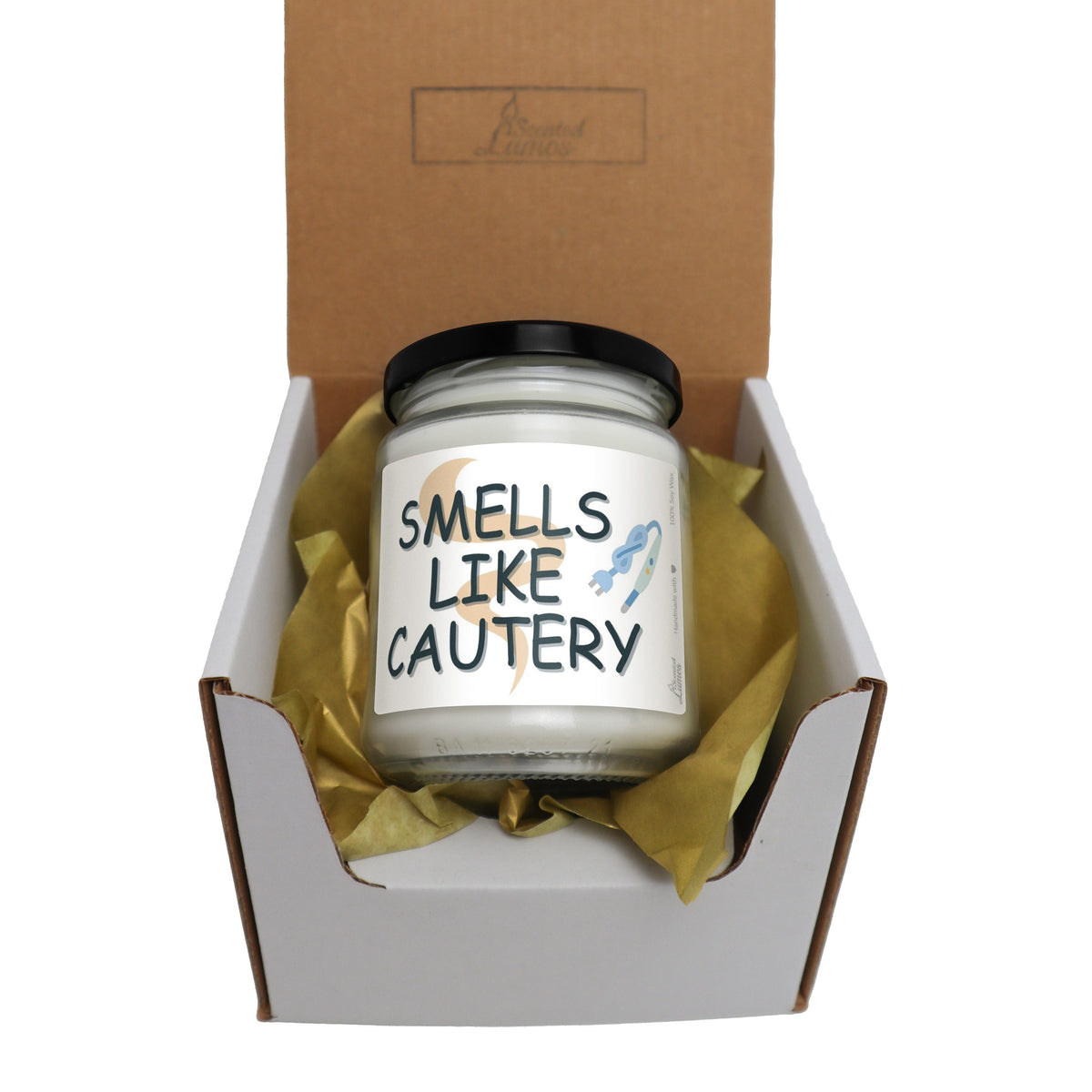 a candle in a box that says smells like cautery