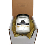 a jar of light up and pray candle in a box