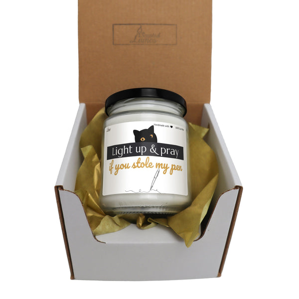 a jar of light up and pray candle in a box
