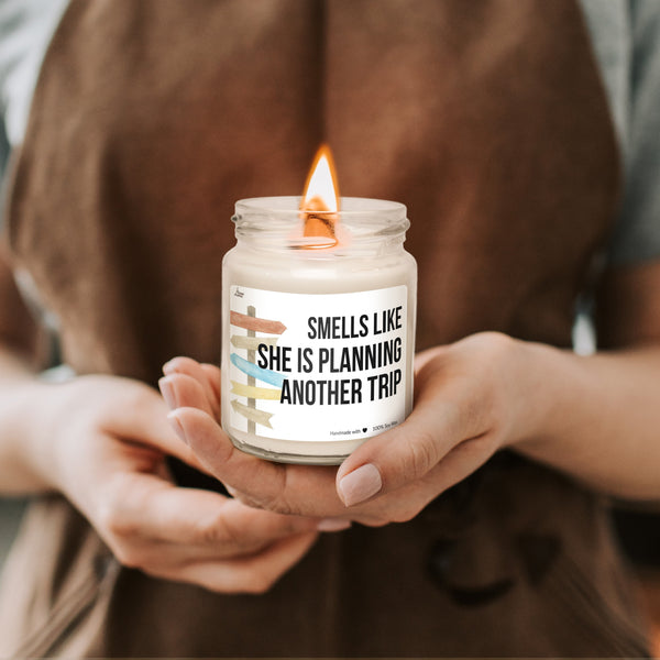a woman holding a candle in her hands