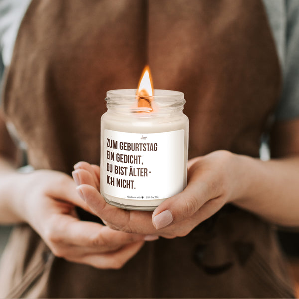 a person holding a candle in their hands