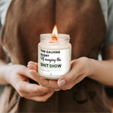 a person holding a candle in their hands