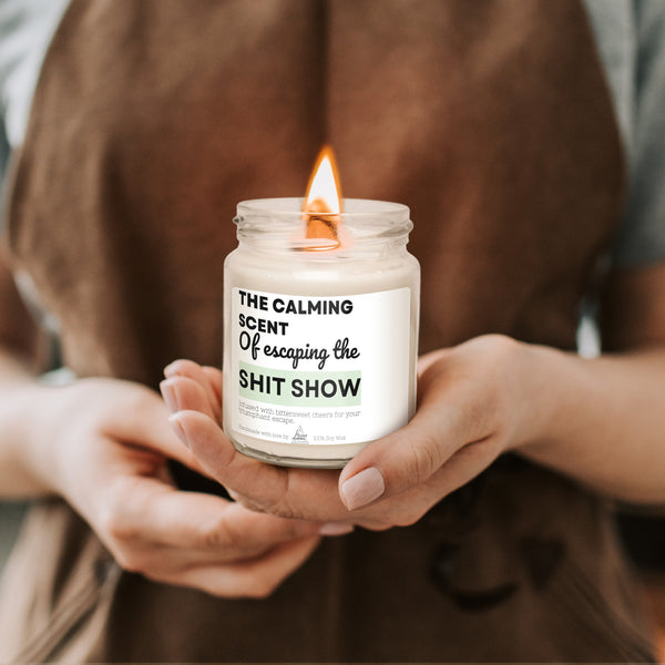 a person holding a candle in their hands