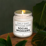 a white candle sitting on top of a wooden table