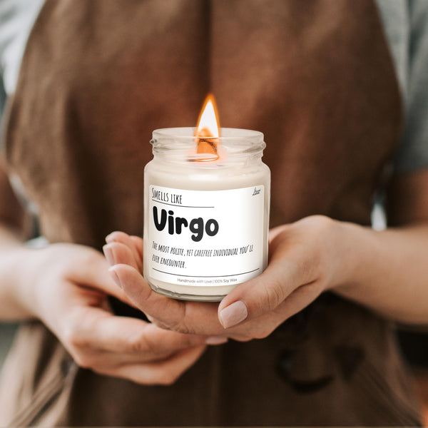 a person holding a candle in their hands
