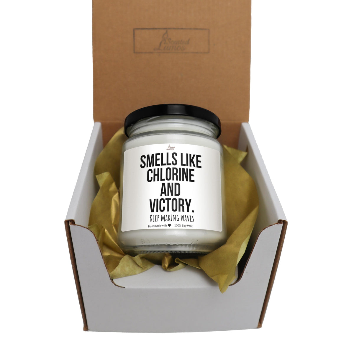 a candle in a box with a brown ribbon around it
