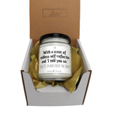 a candle in a gift box with a message