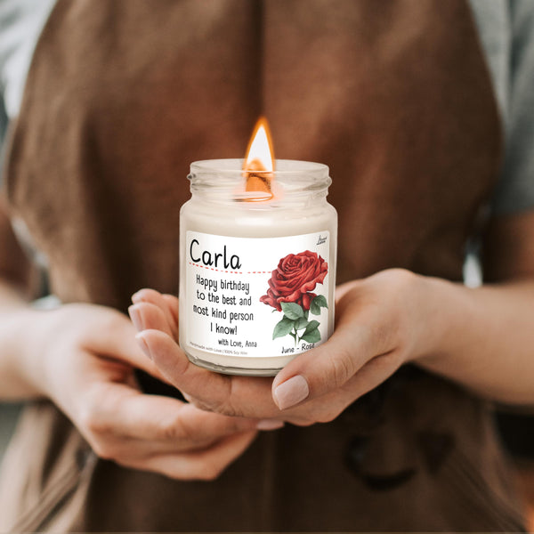 a woman holding a candle in her hands