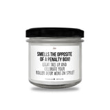 a white candle with a black lid on a white background