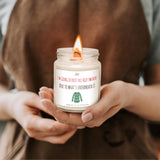 a person holding a candle in their hands