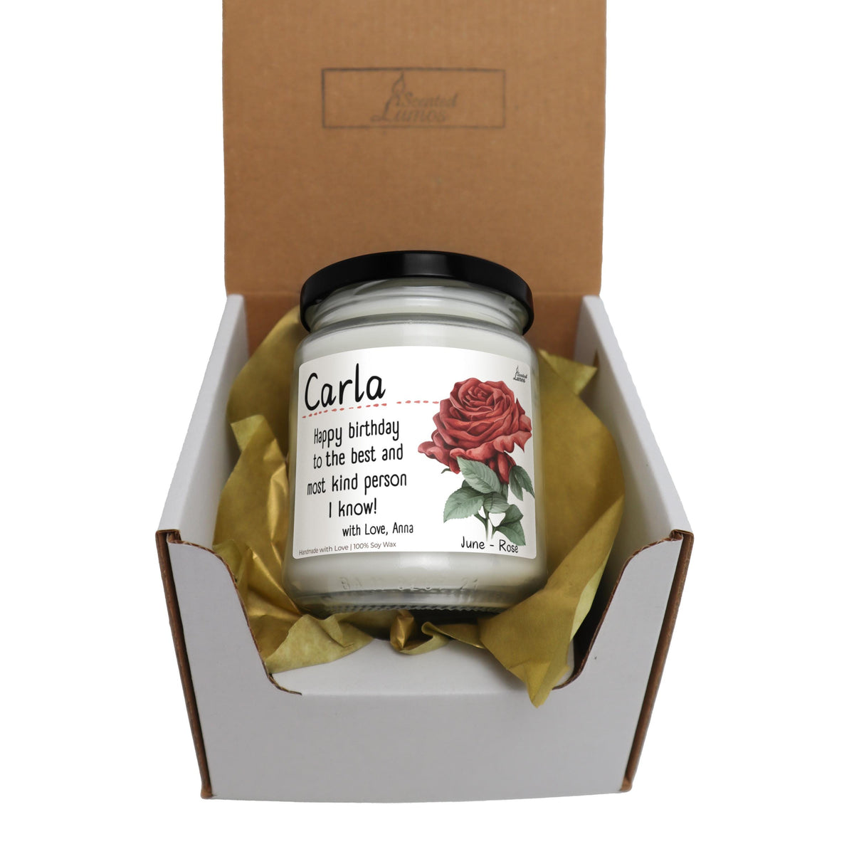 a candle in a box with a rose on it