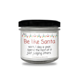 a jar of white candles with a black lid
