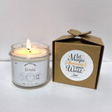 a lit candle sitting next to a cardboard box