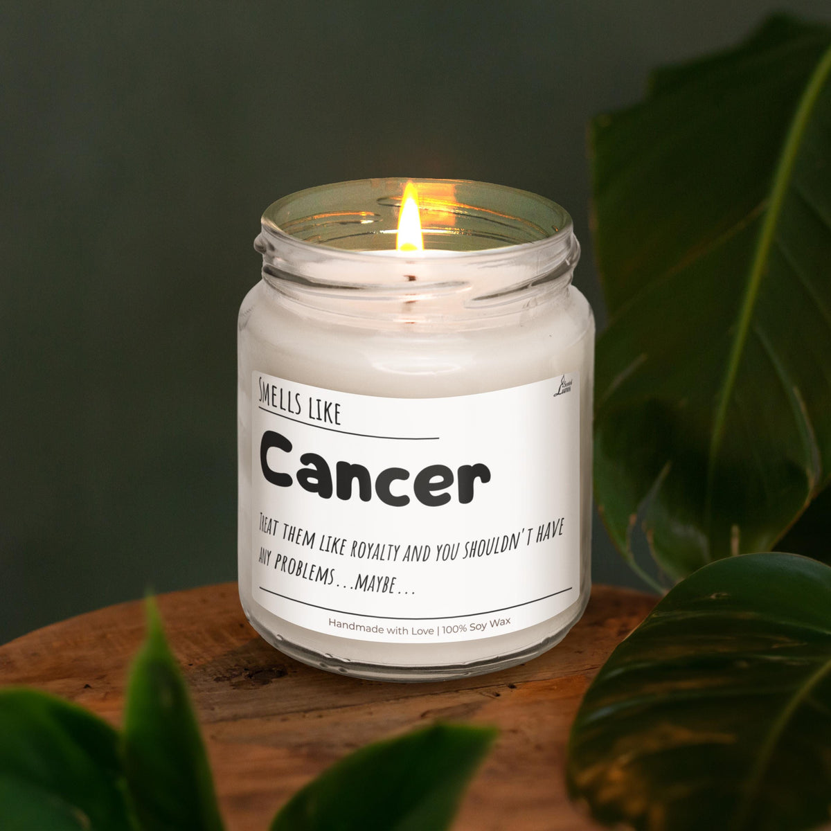 a candle sitting on top of a wooden table