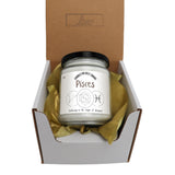 a jar of pisces sits in a box