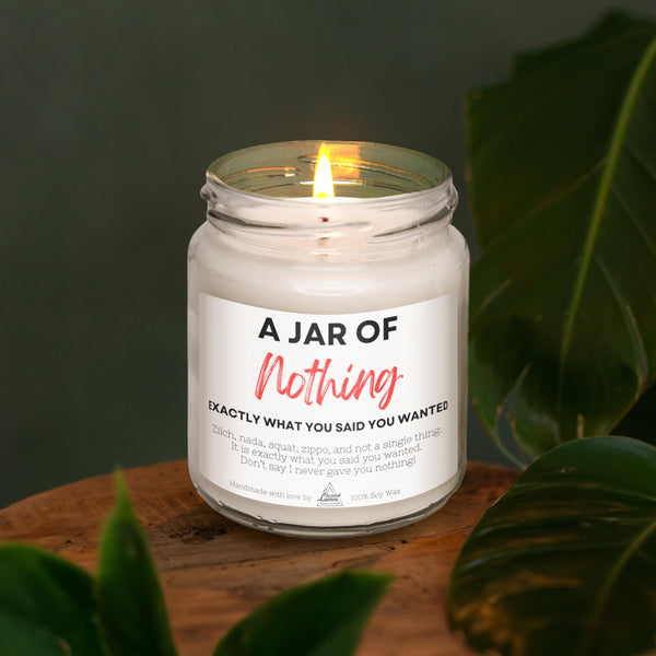 a jar of a candle sitting on top of a wooden table