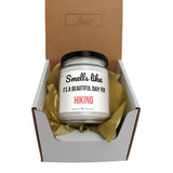a small jar of hiking candle in a box