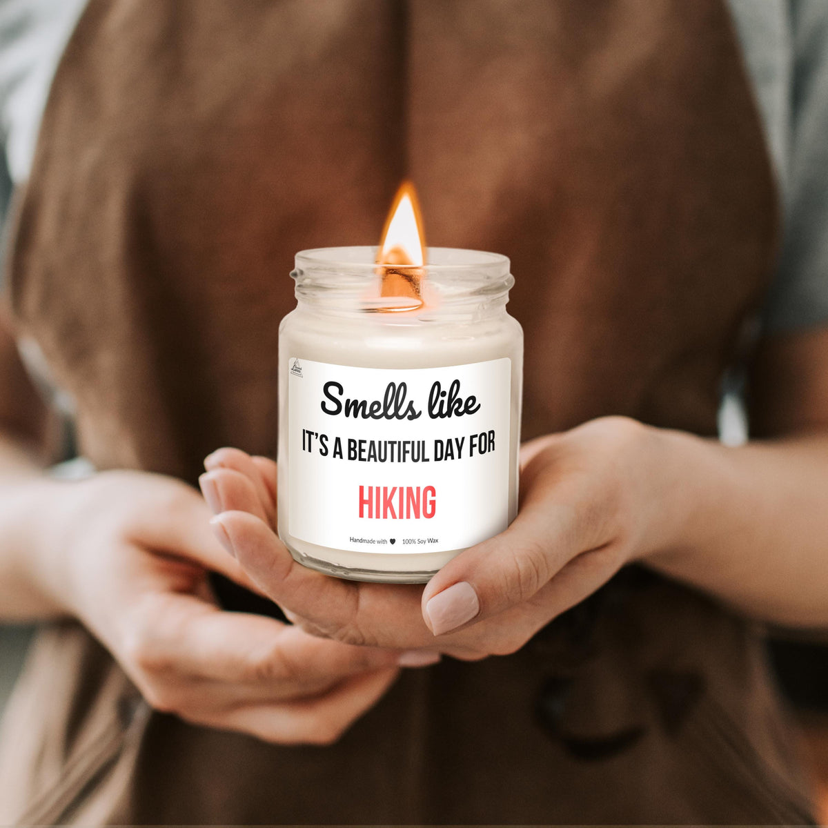 a person holding a candle in their hands