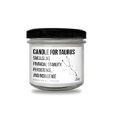 a white candle with a black lid on a white background