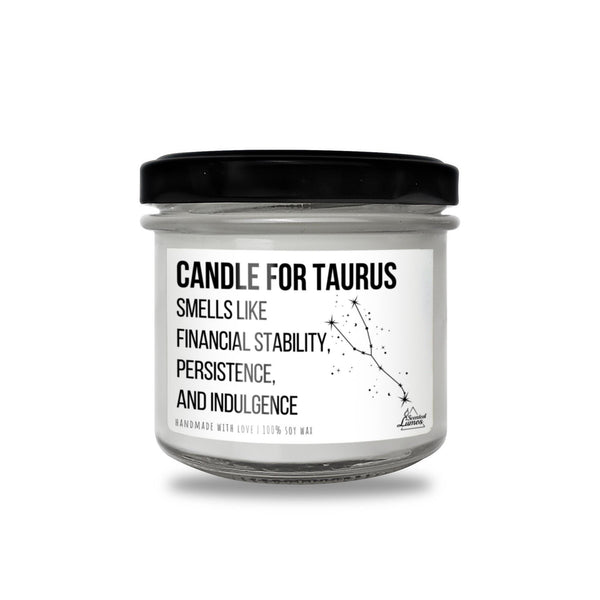 a white candle with a black lid on a white background