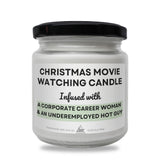 a white candle with a black lid that says christmas movie watching candle